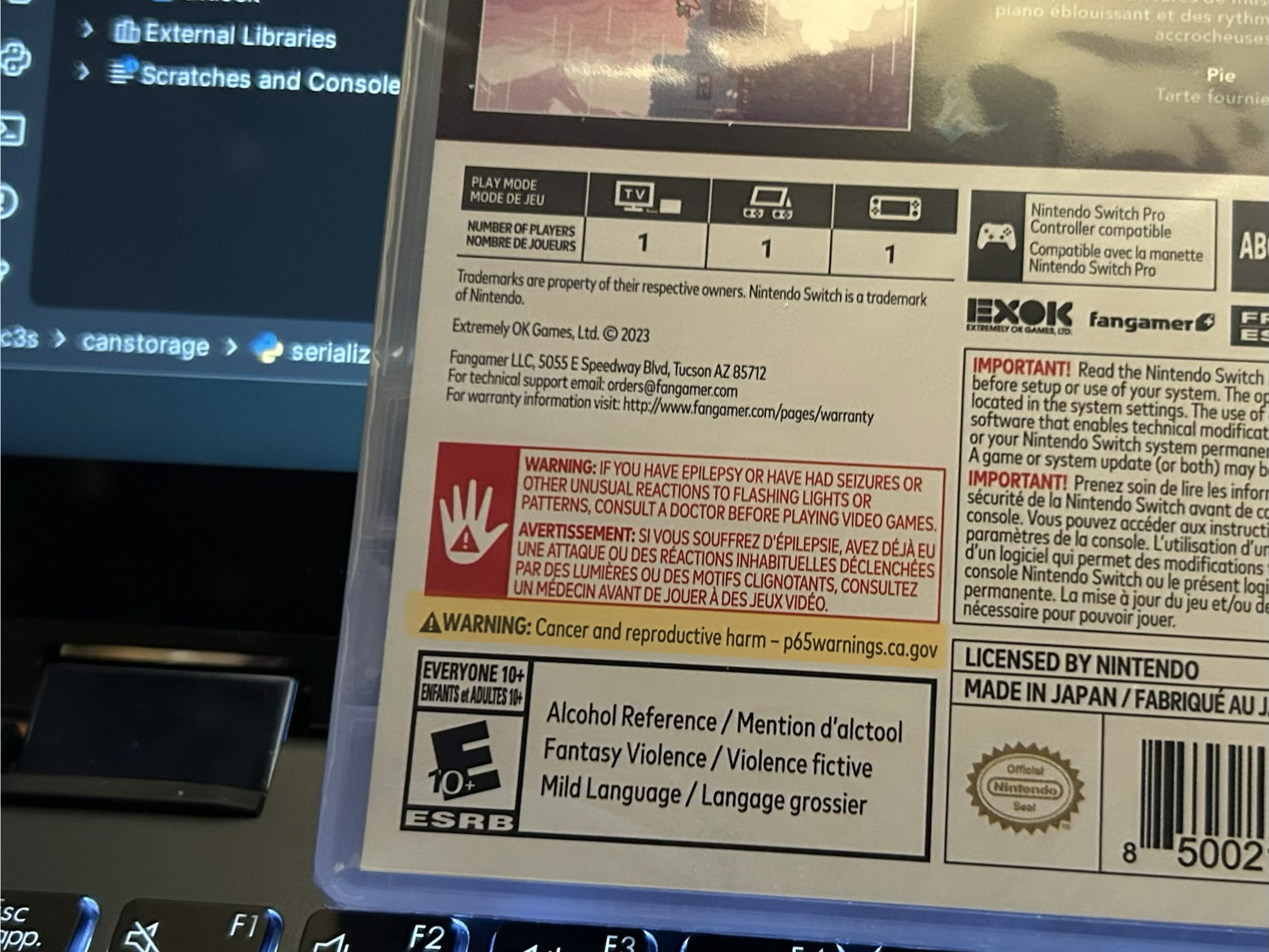 A box of the game Celeste. The ESRB rating shows "Alcohol Reference," "Fantasy Violence," and "Mild Language." There is also a Proposition 65 cancer warning.